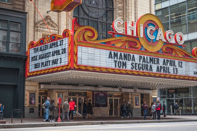 Best of Chicago: Architecture & Highlights City Private Tour - Meeting Chicago beneath the neon theatre sign